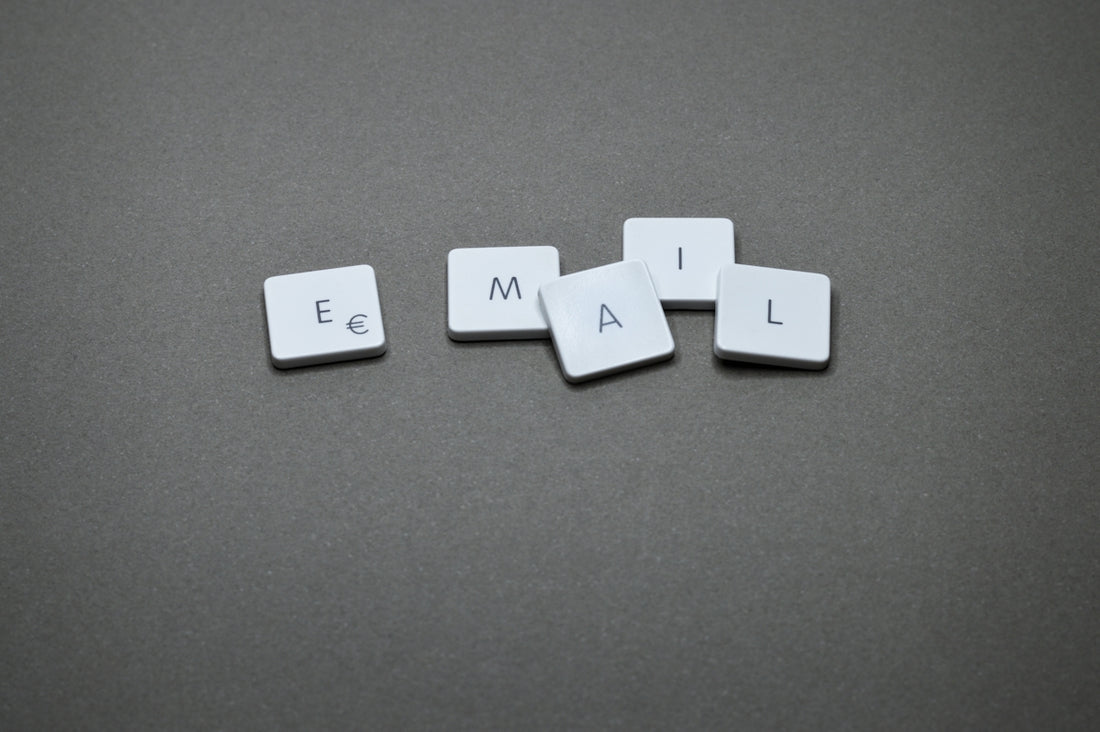 The word email is spelled out with letter tiles.